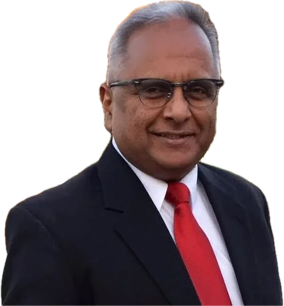 Bernie Lutchman in a dark suit and red tie, smiling